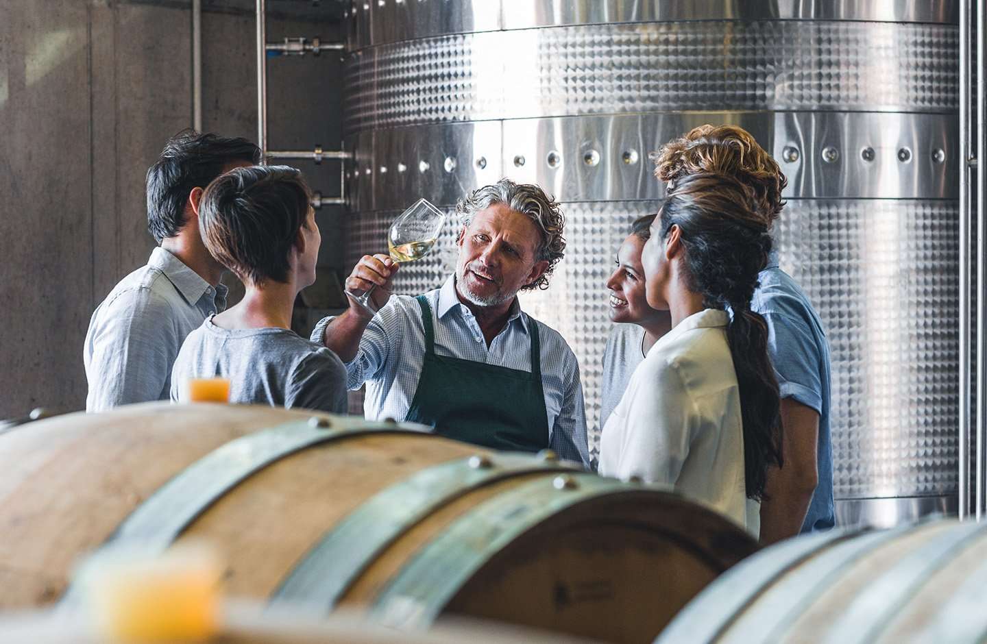 winemaker tasting wine in cellar winemaker tasting wine in cellar